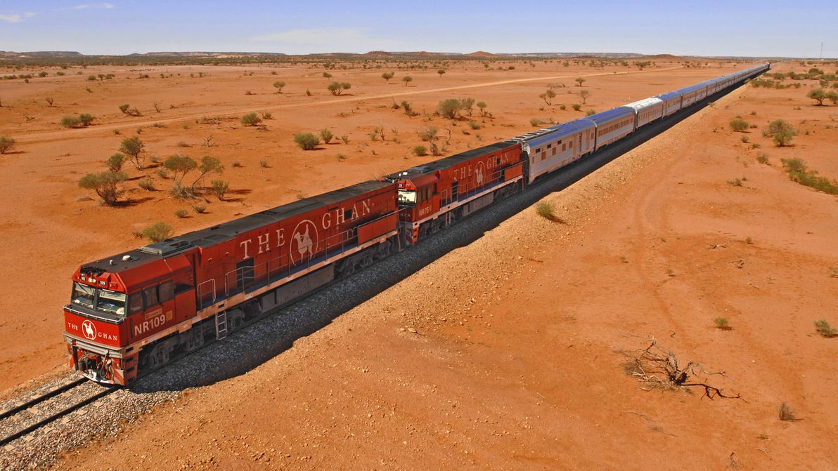 The Ghan roaring through the outback.