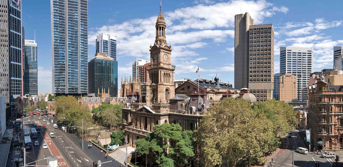 View of the Town Hall building, busy George and Druitt Streets, and St Andrews Cathedral.