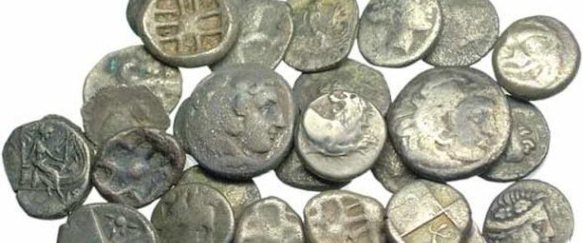 Ancient silver Greek coins.